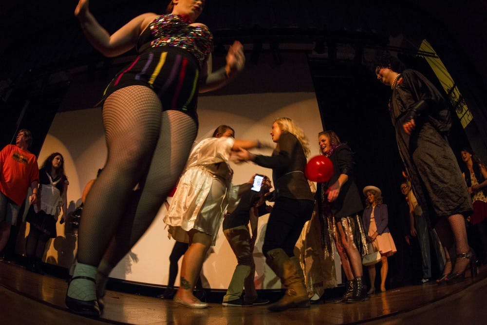 Audience joins the cast on stage at Corner Stone Center for the Arts before the fifth annual showing of The Rocky Horror Picture Show Sept. 29, 2018, in Downtown Muncie. Grace Hollars, DN