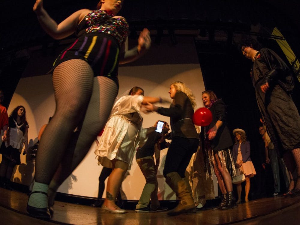 Audience joins the cast on stage at Corner Stone Center for the Arts before the fifth annual showing of The Rocky Horror Picture Show Sept. 29, 2018, in Downtown Muncie. Grace Hollars, DN