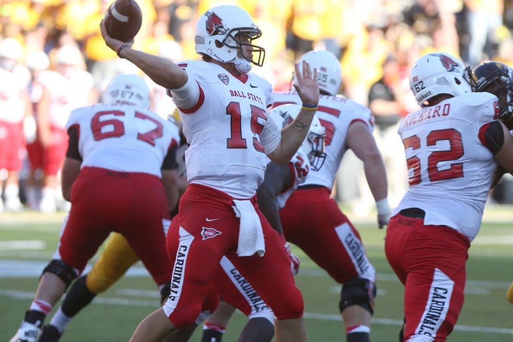 Ball State quarterback Ozzie Mann throws a pass on Sept. 6 in Kinnick Stadium. Mann threw for 129 yards on the game. Iowa defeated Ball State, 17-13. (The Daily Iowan/Tessa Hursh)