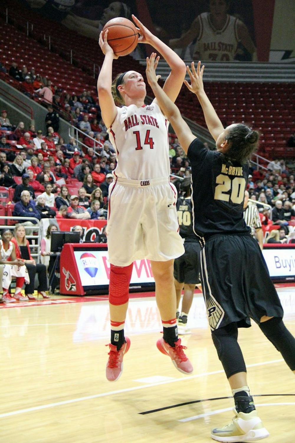 Center Renne Bennett goes up for a shot while being guarded by Dominique McBryde during the Cardinals’ game against Purdue on Dec. 8 in Worthen Arena. Ball State lost 42 to 58. Paige Grider// DN