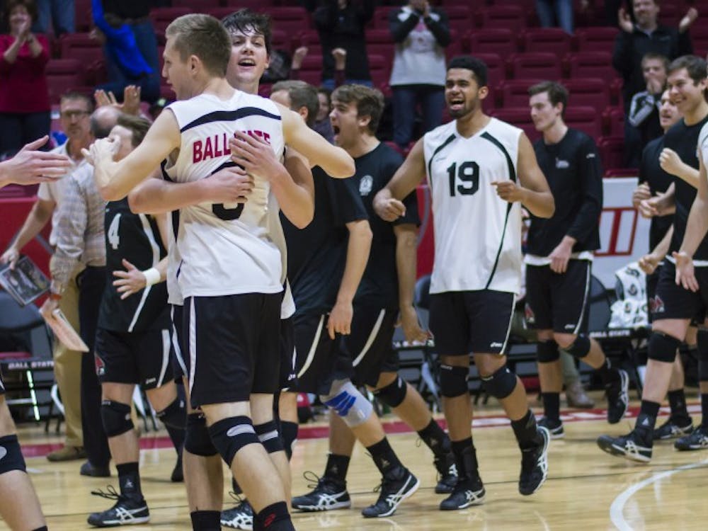 The men's volleyball team celebrates after winning the game against Saint Francis 3-0 on Jan. 12 in Worthen Arena. Teri Lightning Jr., DN