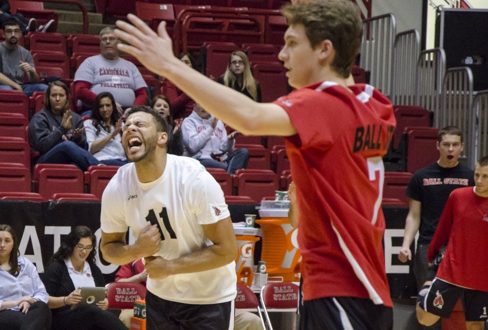 Outside attackers Larry Wrather and Shane Witmer celebrate a point for Ball State after a volley with Sacred Heart during the Jan. 11 match in Worthen Arena. DN PHOTO COREY OHLENKAMP