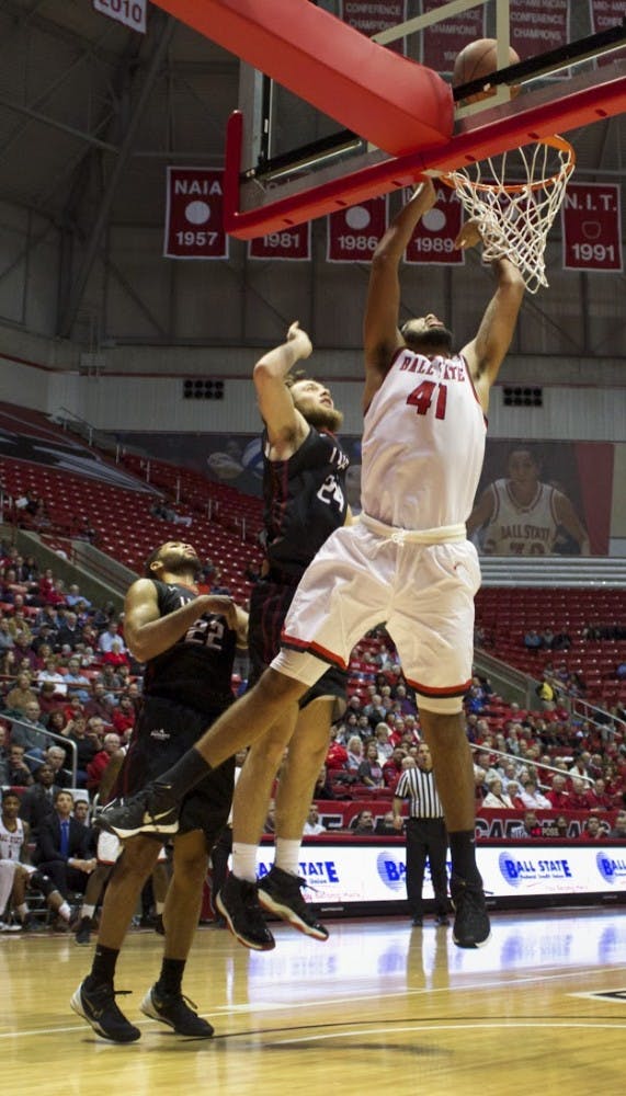 Trey Moses, a freshman forward center for the Ball State Cardinals, attempts to score a layup during the game against IUPUI on Dec. 1 in John E.&nbsp;Worthen Arena. DN PHOTO GRACE RAMEY