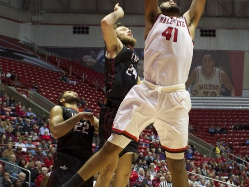 Trey Moses, a freshman forward center for the Ball State Cardinals, attempts to score a layup during the game against IUPUI on Dec. 1 in John E.&nbsp;Worthen Arena. DN PHOTO GRACE RAMEY