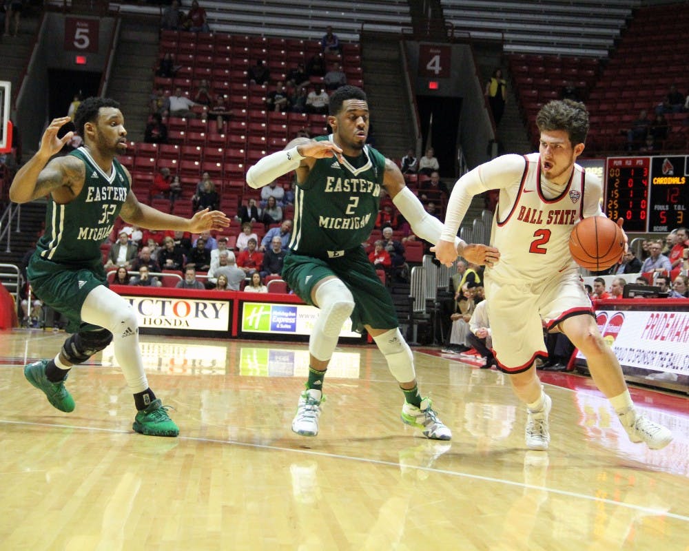 Guard Tayler Persons drives pass Eastern Michigan’s James Thompson IV (center) during the Cardinals’ game against the Eagles on Feb. 21 in John E. Worthen Arena. The Cardinals next home game is Nov. 17 against Stony Brook. Paige Grider, DN File