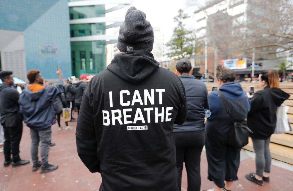 A demonstrator stands during a march in central Auckland, New Zealand, June 1, 2020, to protest the death of United States' George Floyd, a black man who died in police custody in Minneapolis on May 25. Floyd, who after a white police officer who is now charged with murder, Derek Chauvin, pressed his knee into Floyd's neck for several minutes even after he stopped moving and pleading for air. (Dean Purcell/New Zealand Herald via AP)
