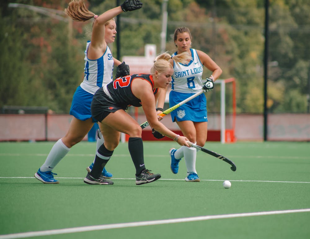 Graduate student midfielder Kerrianne McClay battles against two Saint Louis players Sept. 17 at Briner Sports Complex. McClay played for the whole game. Sami Farmer, DN