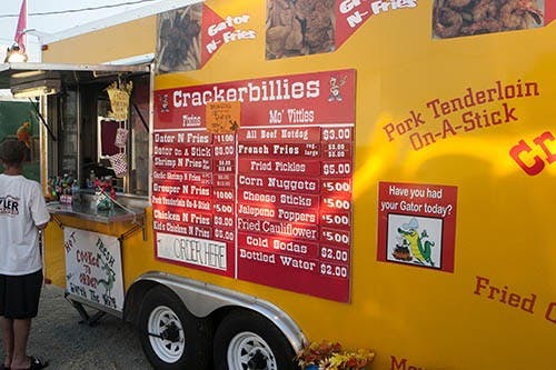 Crackerbillies, a food truck at the Delaware County Fair this week, features a variety of food. Their signature dish is their gator, which is hand-battered in a spicy breading. DN PHOTO JORDAN HUFFER