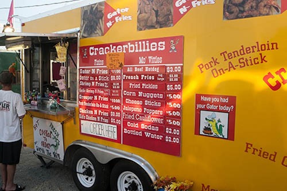 Crackerbillies, a food truck at the Delaware County Fair this week, features a variety of food. Their signature dish is their gator, which is hand-battered in a spicy breading. DN PHOTO JORDAN HUFFER