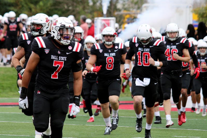 Inside linebacker redshirt senior Brandon Martin (7) runs out onto the field for the Homecoming game against Miami Ohio on Oct. 23, 2021, at Scheumann Stadium in Muncie, IN. Amber Pietz, DN