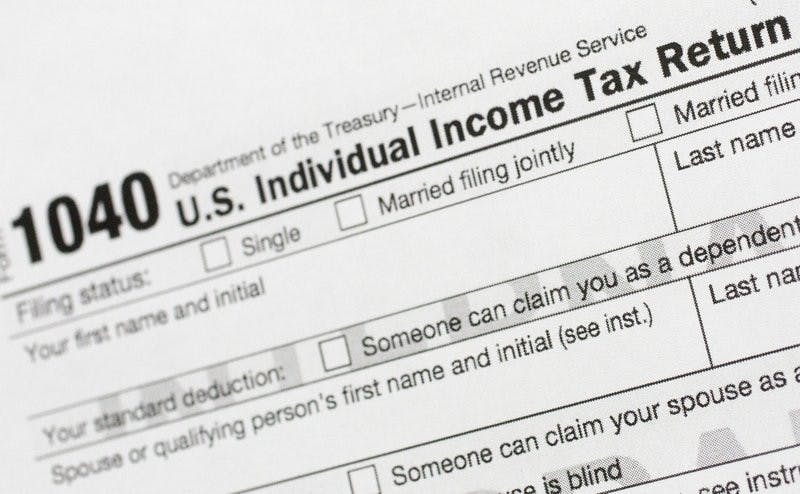 This July 24, 2018, file photo shows a portion of the 1040 U.S. Individual Income Tax Return form. The IRS began accepting and processing tax returns for individuals on Monday, Jan. 27, 2020. (AP Photo/Mark Lennihan, File)
