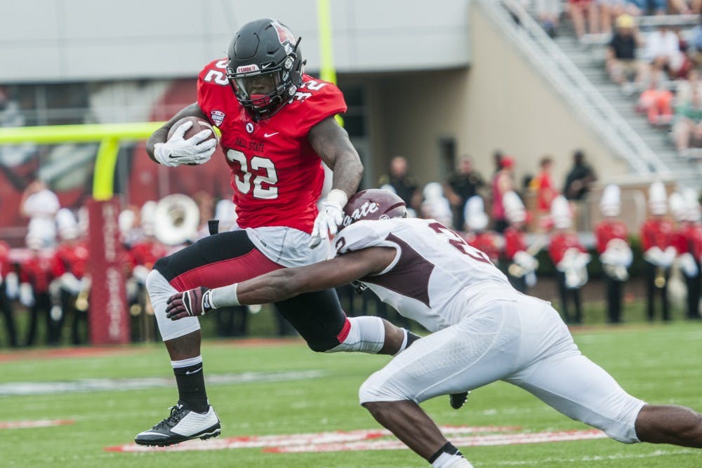 Senior running back Jahwan Edwards attempts to elude a Colgate defender during the game on Aug. 30 at Scheumann Stadium. DN PHOTO JONATHAN MIKSANEK