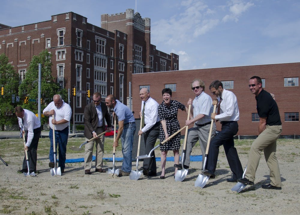 Speakers and other guests break the ground on June 10 during the ceremony for the Cornerstone Park. DN PHOTO BREANNA DAUGHERTY