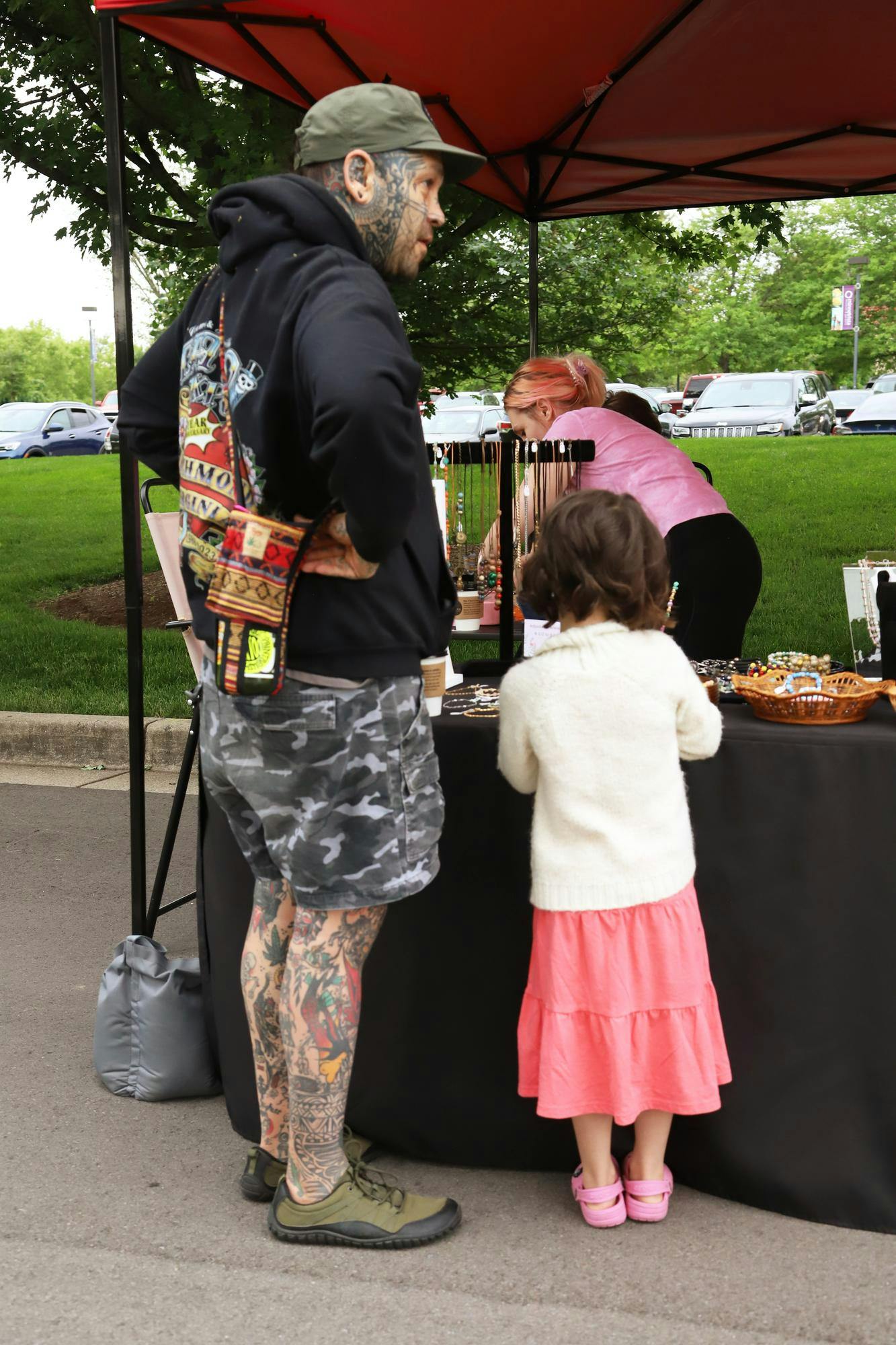 Attendees at the Minnetrista Museum and Gardens farmers market look at hand crafted jewelry for sale during the June 8 farmers market. Artisans, bakers, farmers and more are welcome to share their goods at the farmers market. Olivia Ground, DN