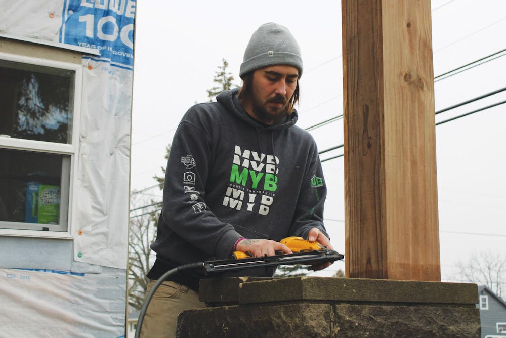 A Muncie YouthBuild participant works outside Jan. 25, 2024, at a residence in Muncie, Indiana. Participants in YouthBuild range from ages 18-24. Eastern Indiana Works, Photo provided. 
