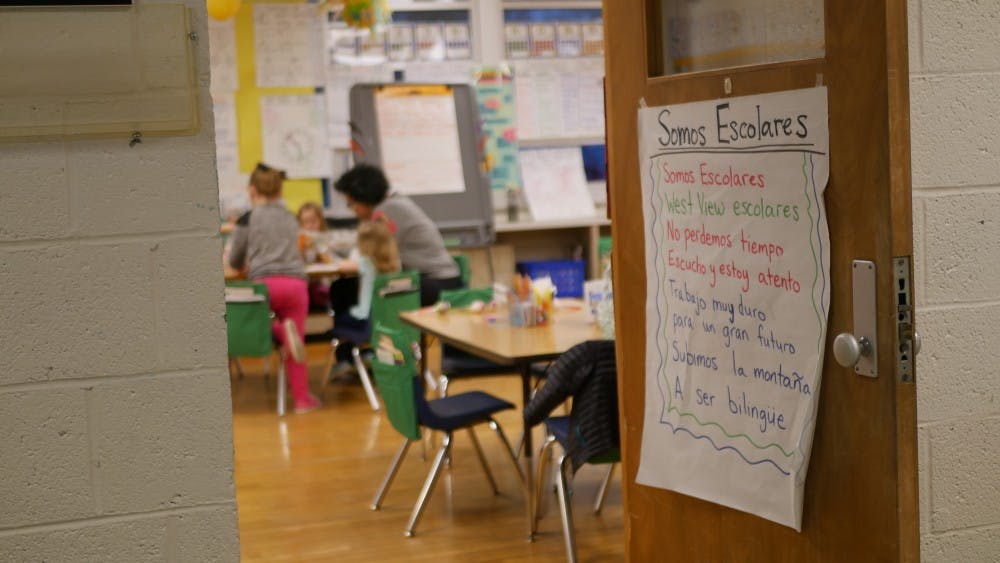 A sign is displayed on the door of a classroom where West View Elementary School students gather while their parents attend the informational session about the Dual Language immersion program Feb. 28, 2019. Students learn English alongside Spanish from as early as kindergarten. Jake Helman, DN