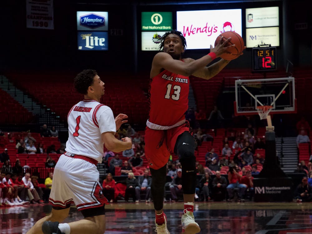 Redshirt freshman guard Kani Acree prepares to drive for a basket in a game against Northern Illinois on March 6 at the Convocation Center. The Cardinals defeated the Huskies 75-54. Jack Williams, DN