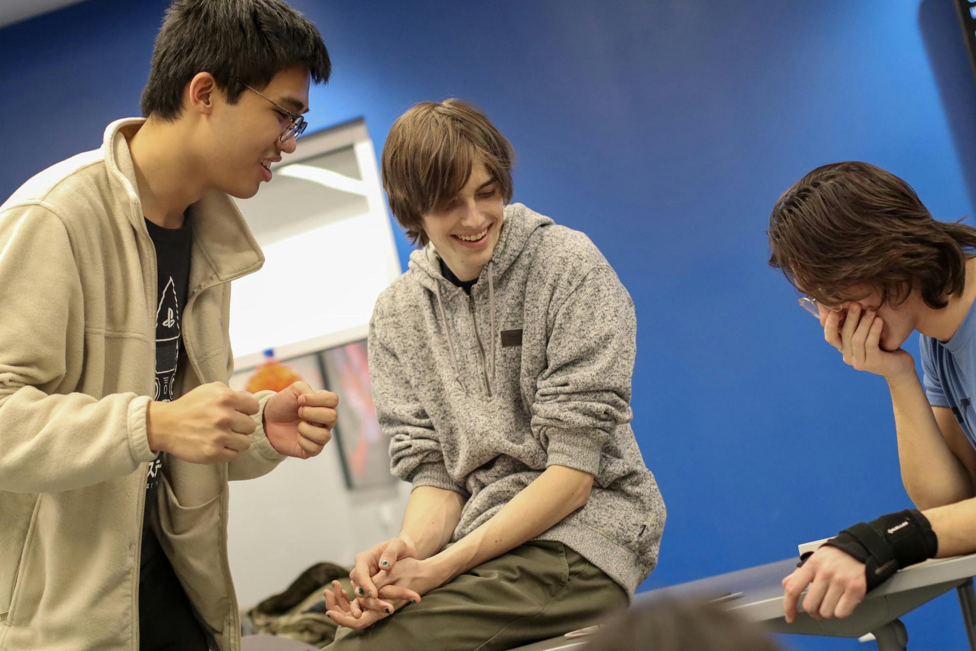 First-year English education major Chrisitan Avila watches a game spinner in anticipation at the Asian Student Union (ASU) meeting Feb. 6 in the Multicultural Center. Avila discusses how ASU brings together the Asian community on campus. Maya Kim, DN