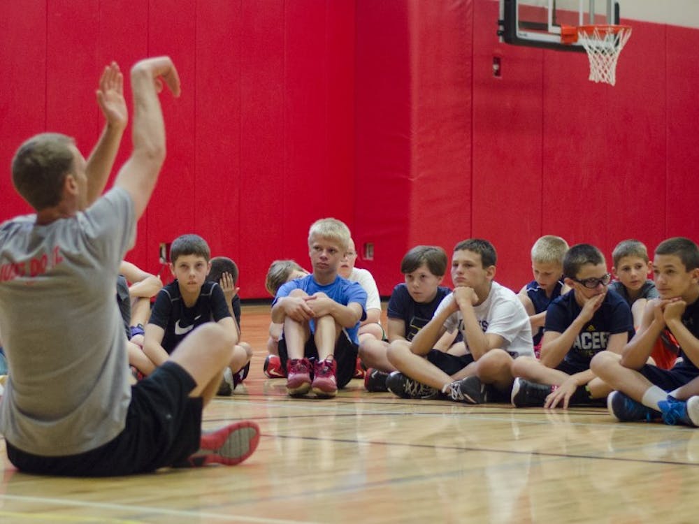 Children participated in the boys basketball camp with the Ball State men's basketball team. The camp is meant to help young players improve their skills and technique. DN PHOTO BREANNA DAUGHERTY