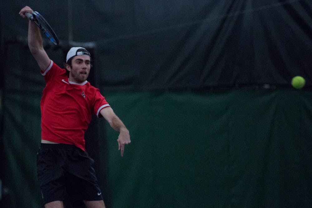 <p>Junior Tom Carney returns a ball in a doubles match against the University of Toledo. Ball State won 5 to 2 on March 24 at Northwest YMCA in Muncie. <strong>Eric Pritchett, DN</strong></p>