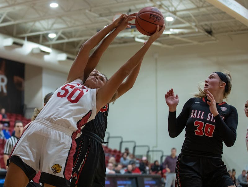 Sophomore Forward/ Center Macee Williams jumps for the ball against the Cardinals' Nov. 5, 2019, in the IUPUI Gymnasium in Indianapolis, Ind. Williams scored 15 points against the Cardinals. Jacob Musselman, DN