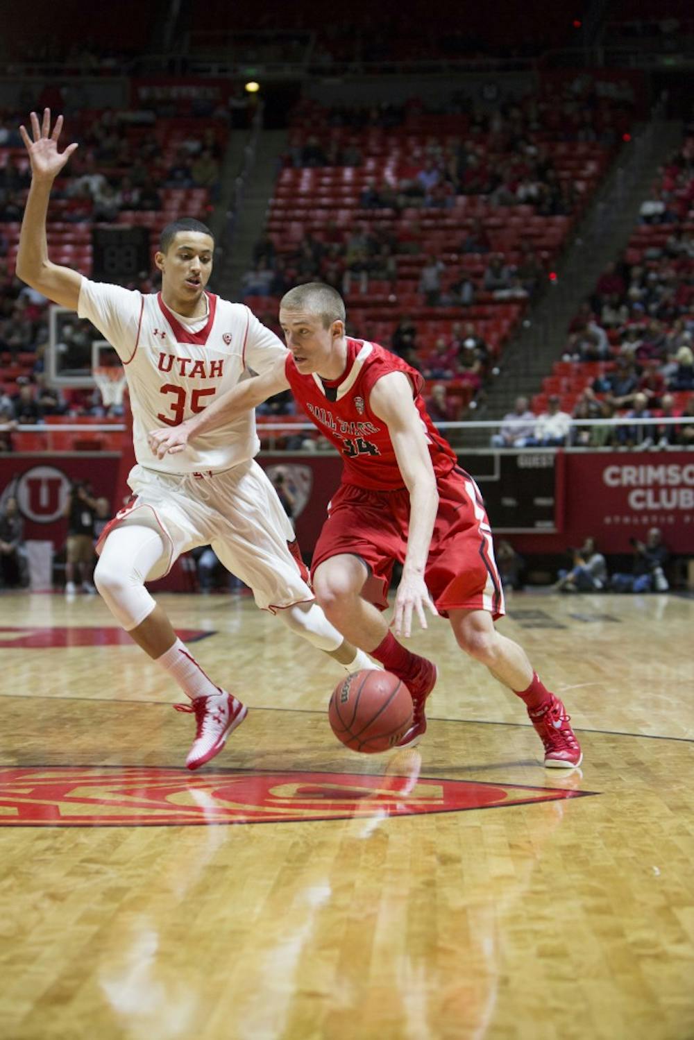 Freshman forward Sean Sellers drives the ball down the court during the game against Utah on Nov. 14 at the Jon M. Huntsman Center. Ball State lost 90-72. Chris Ayers | The Daily Utah Chronicle