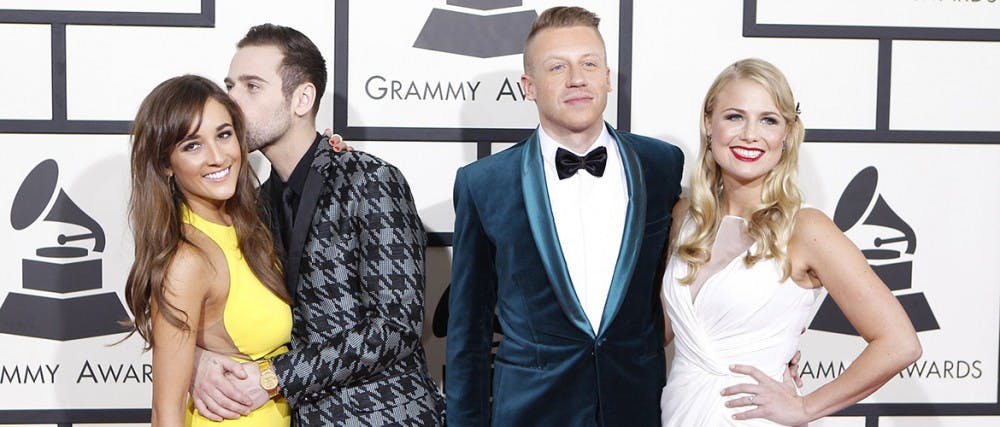 Recording artists Ryan Lewis, 2nd from left, and Macklemore with dates arrive for the 56th Annual Grammy Awards at Staples Center in Los Angeles on Sunday, Jan. 26, 2014.  (Wally Skalij/Los Angeles Times/MCT)