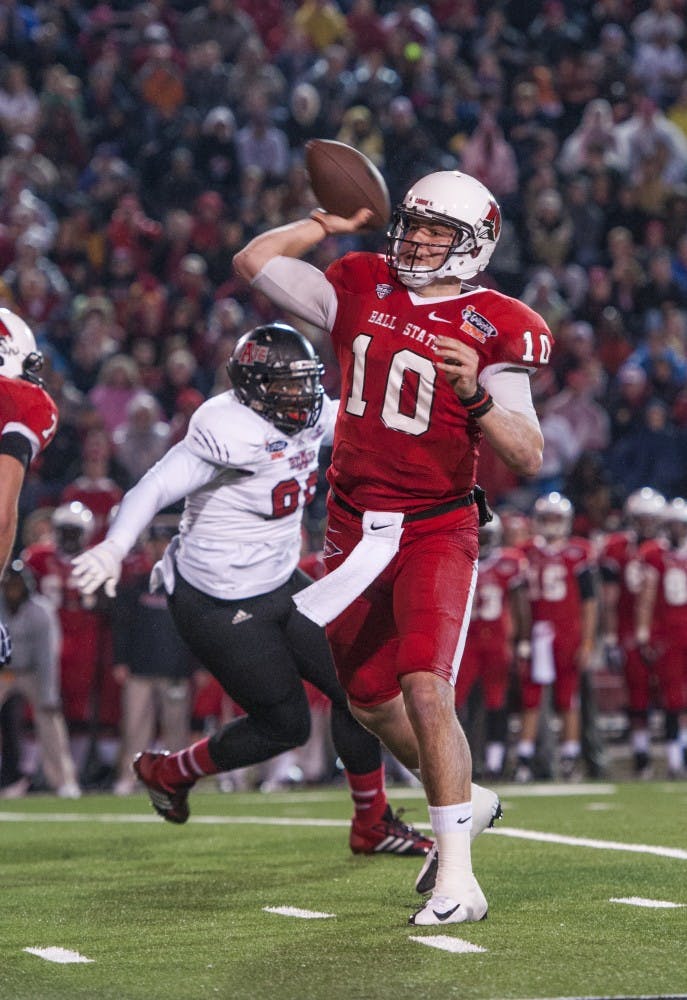 Senior quarterback Keith Wenning attempts to throw the ball down field against Arkansas State on Jan. 5 during the GoDaddy Bowl at Ladd-Peebles Stadium in Mobile, Ala. DN PHOTO JONATHAN MIKSANEK