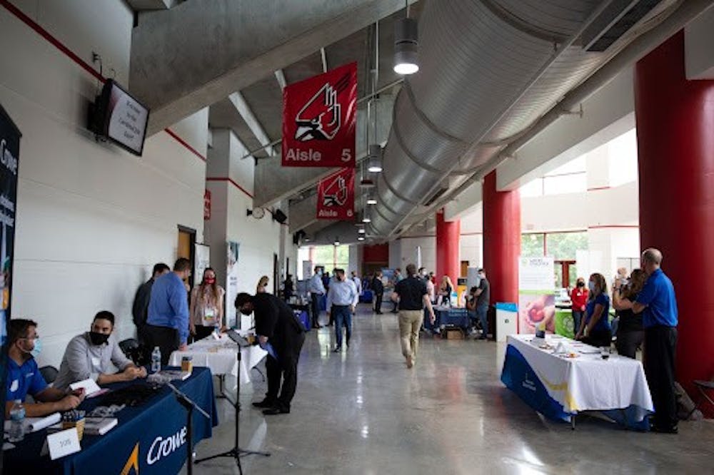 <p>Employers and students line up in Worthen Arena for the Cardinal Job Fair Sept. 15. All attendees were required to wear masks to protect against the COVID-19 pandemic. <strong>Richard Kann, DN</strong></p>
