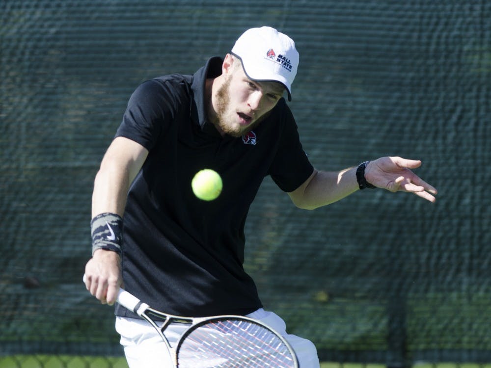 Senior Lucas Anderson hits a forehand during his singles match against Northern Illinois University on April 1 at the Cardinal Creek Tennis Center. Ball State won the match 4-3. Emma Rogers // DN 