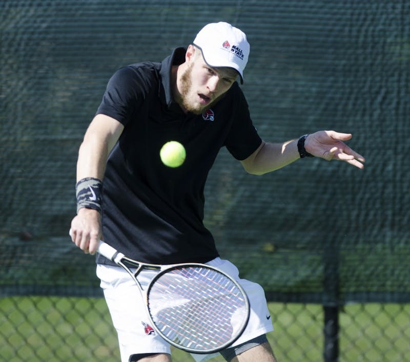 Senior Lucas Anderson hits a forehand during his singles match against Northern Illinois University on April 1 at the Cardinal Creek Tennis Center. Ball State won the match 4-3. Emma Rogers // DN 