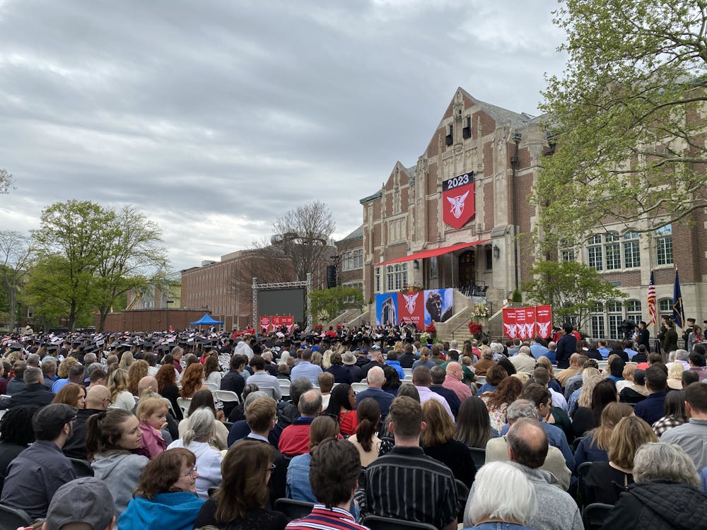 People sit down in the Quad waiting for the main 2023 spring commencement ceremony to begin May 6, 2023. Grayson Joslin, DN