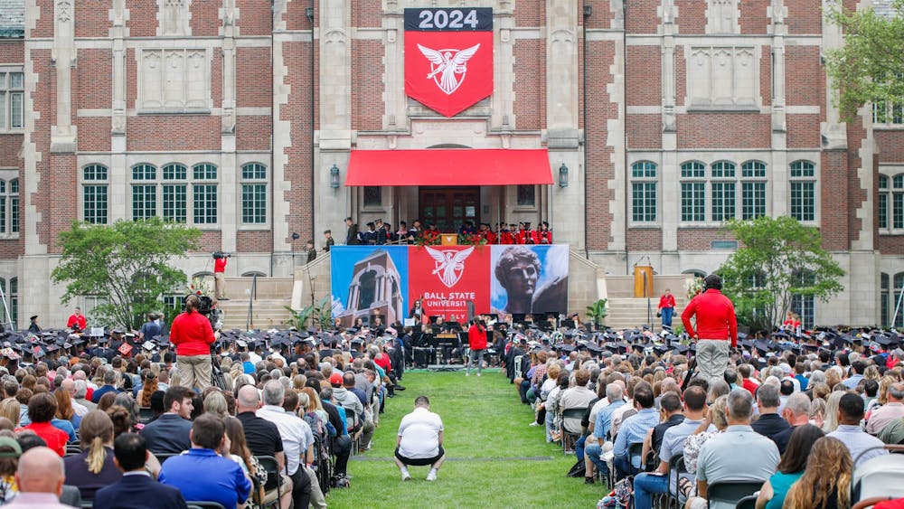 Student, faculty and family spread out in front of Doma during commencment May 4 at The Quad. President Mearns hosted the ceremony and recognized each school of the university. Andrew Berger, DN
