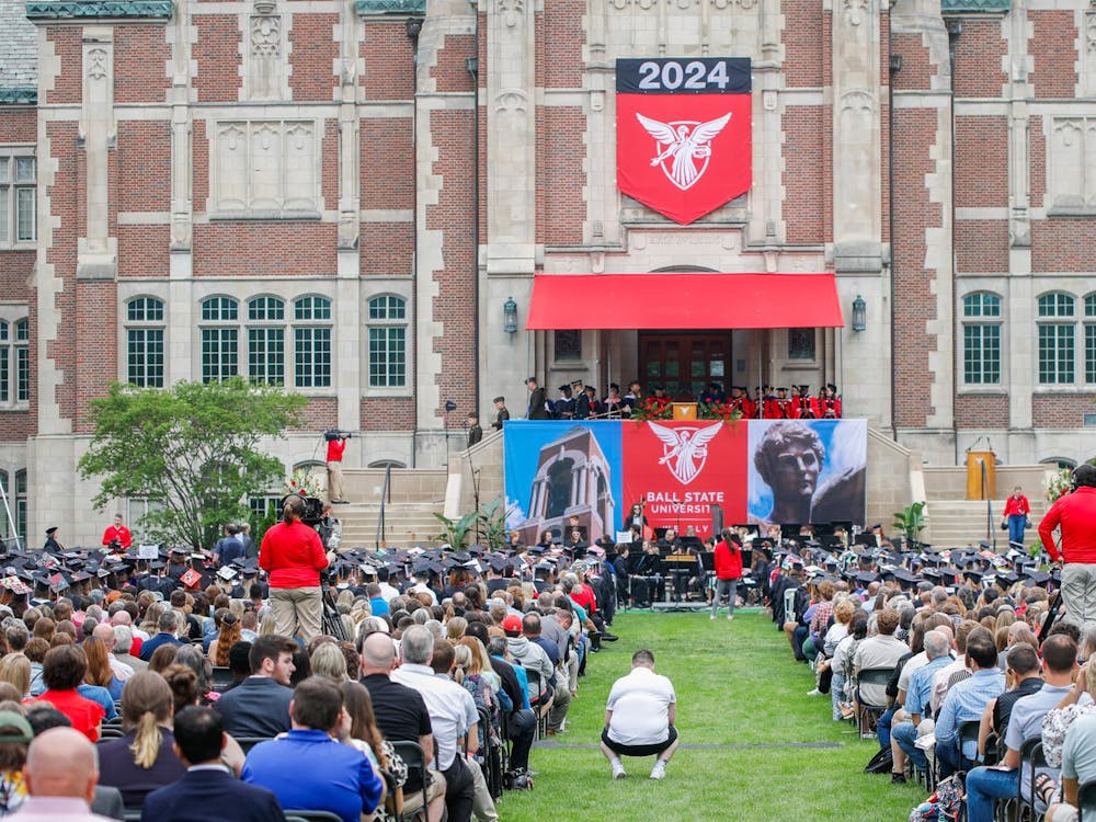 Student, faculty and family spread out in front of Doma during commencment May 4 at The Quad. President Mearns hosted the ceremony and recognized each school of the university. Andrew Berger, DN