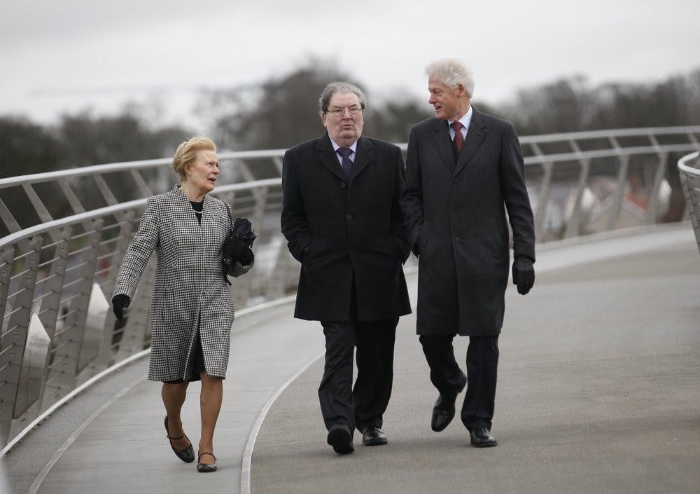 &nbsp;In this March 5, 2014 file photo former US President Bill Clinton, right, with former Social Democratic Labour Party leader John Hume and Hume's wife Pat walk across the Peace Bridge, in Londonderry Northern Ireland. The family of politician John Hume, who won Nobel Peace Prize for work to end violence in Northern Ireland, says he has died. He was 83. The Catholic leader of the moderate Social Democratic and Labour Party , Hume was regarded by many as the principal architect behind the peace agreement. (AP Photo/Peter Morrison)