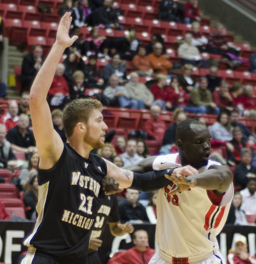 Senior center Majok Majok tries to block Western Michigan player Shayne Whittington in the second half Feb. 26 at Worthen Arena. DN PHOTO AUDREY ADDINGTON 