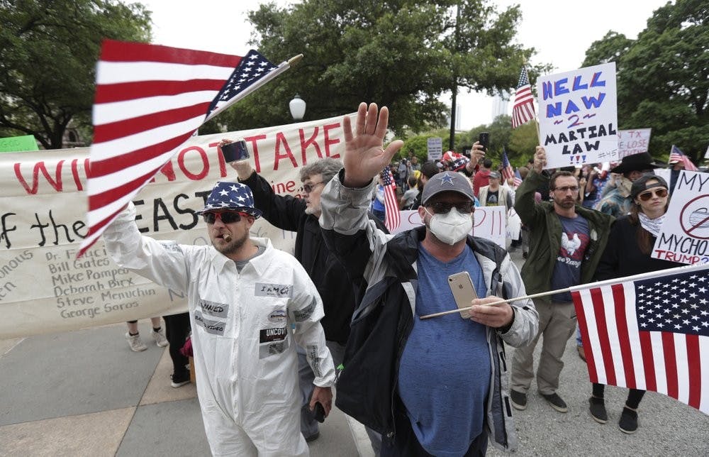 <p>Protesters rally at the Texas State Capitol to speak out against Texas' handling of the COVID-19 outbreak, in Austin, Texas, Saturday, April 18, 2020. Austin and many other Texas cities remain under stay-at-home orders due to the COVID-19 outbreak except for essential personal.<strong> (AP Photo/Eric Gay)</strong></p>