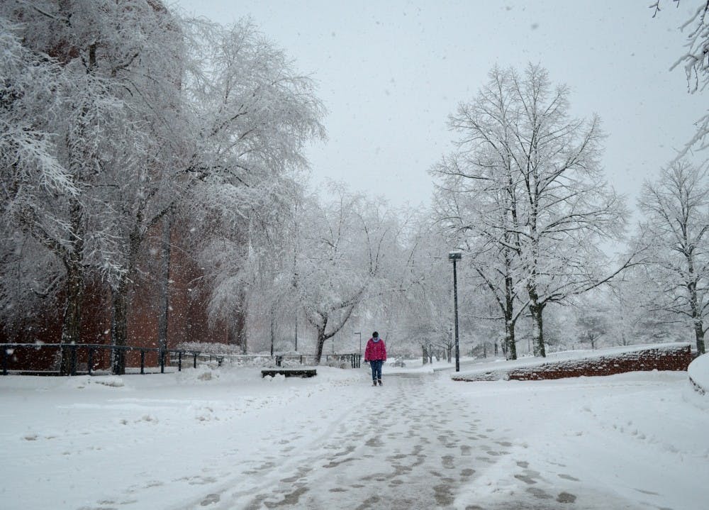 A student walks past the Bracken Library during the afternoon of Jan. 5. DN PHOTO BREANNA DAUGHERTY 