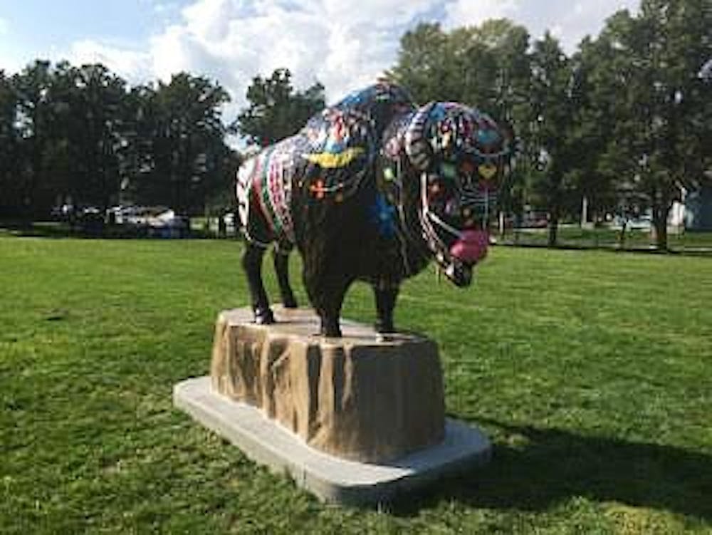 <p>Muncie painted a bison statue named Neolin to represent the county's heritage as part of the Bison-tennial Public Art Project. The bison are part of the celebration of Indiana's 200th birthday. <em>Brynn&nbsp;</em><em>Mechem // DN</em></p>
