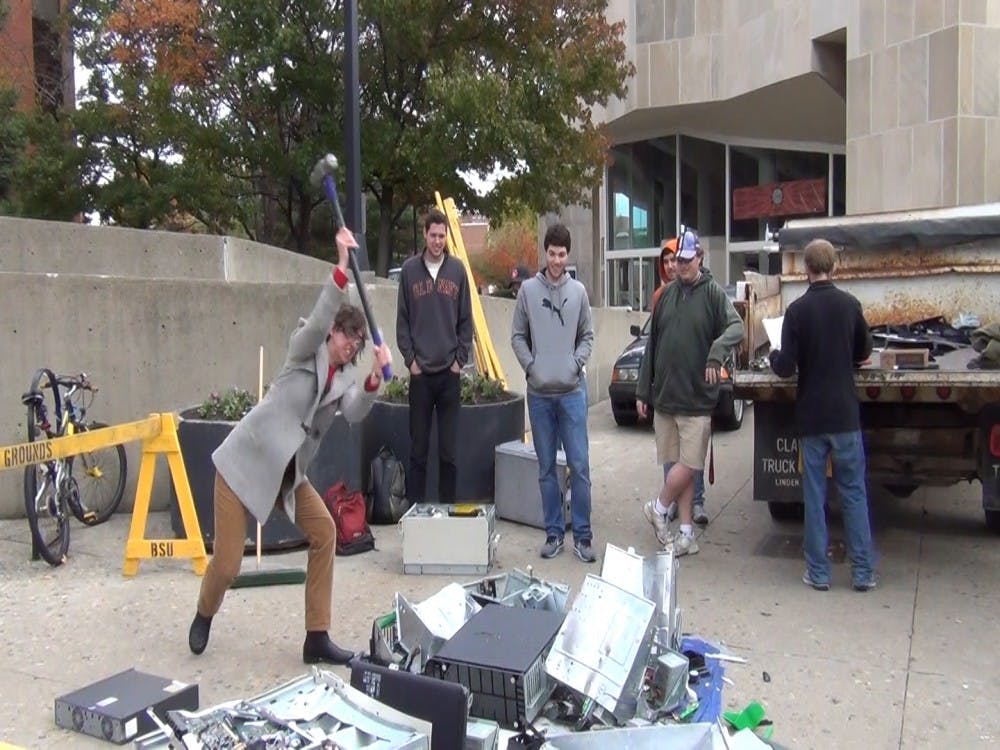 	Students smash computers outside of Braken Library around 3 p.m. Nov. 1. Three swings cost $2, and proceeds go toward the Computer Technology Student organization. DN PHOTO JACOB BURBRINK