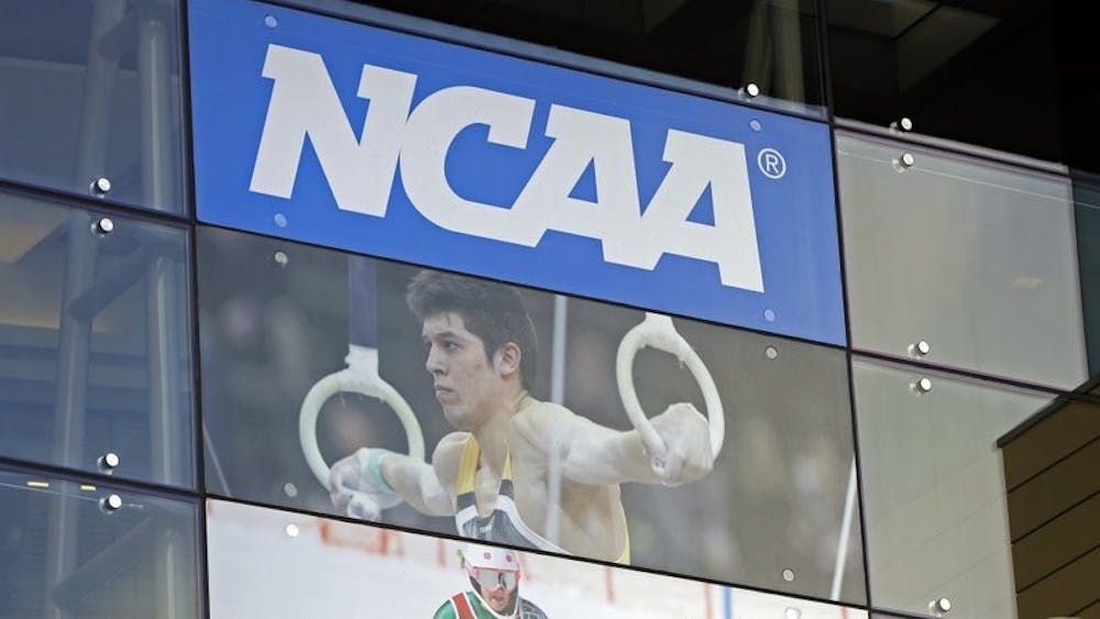 In this April 25, 2018, file photo, the NCAA headquarters is shown in Indianapolis. The NCAA is expected to approve a recommendation to all athletes who compete in fall sports, including football, over the next 10 months to not be charged a year of eligibility. It&#x27;s great news for current players, but comes with some complications for teams, coaches and future college football players. (AP Photo/Darron Cummings, File)