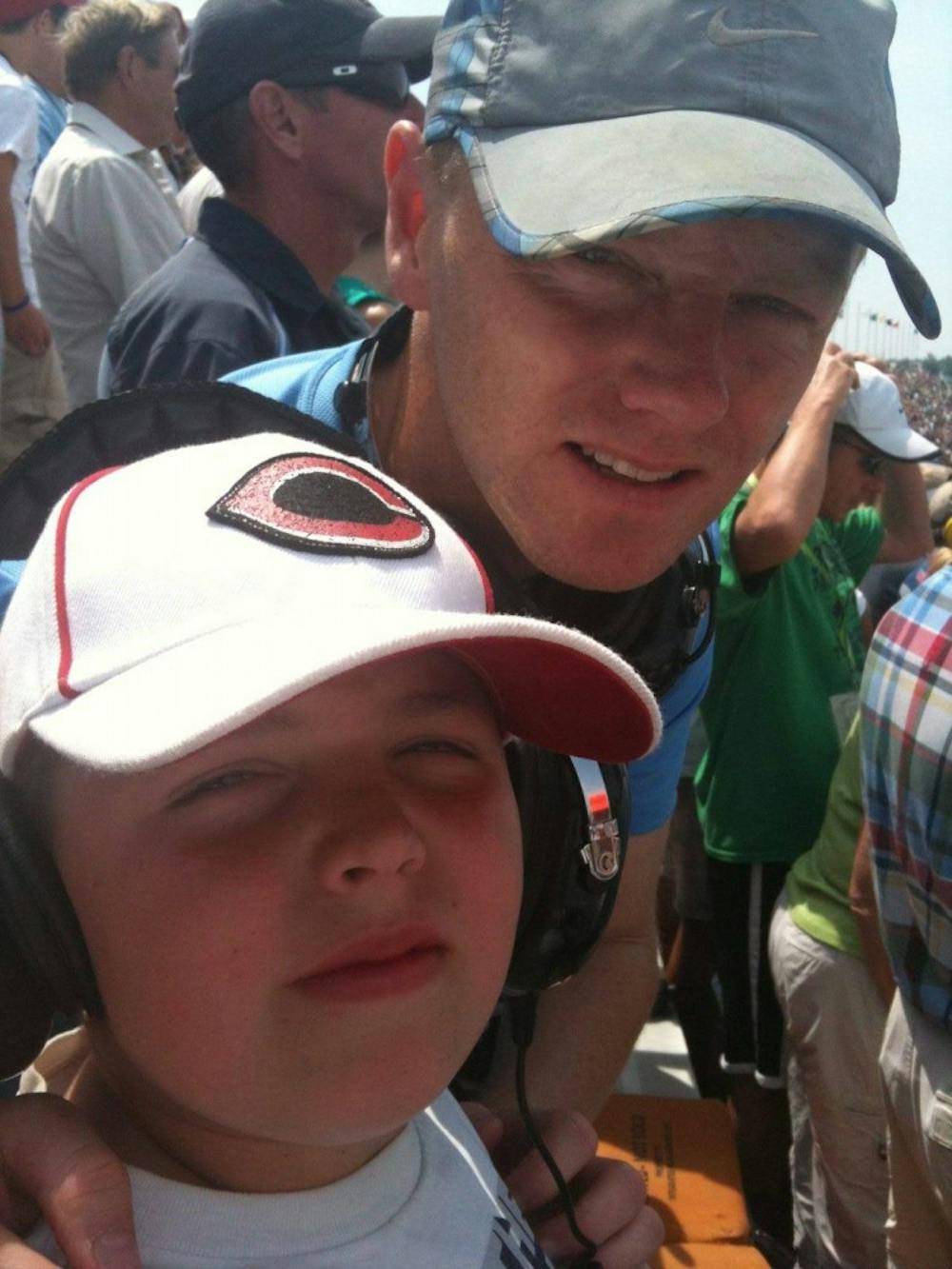 <p>Larry Markle and his son Quentin smile for a picture at the Indianapolis 500 May 29, 2011, at Indianapolis Motor Speedway. It was Quentin's first time at the Indy 500, and he has now been to five. <strong>Larry Markle, Photo Provided</strong></p>