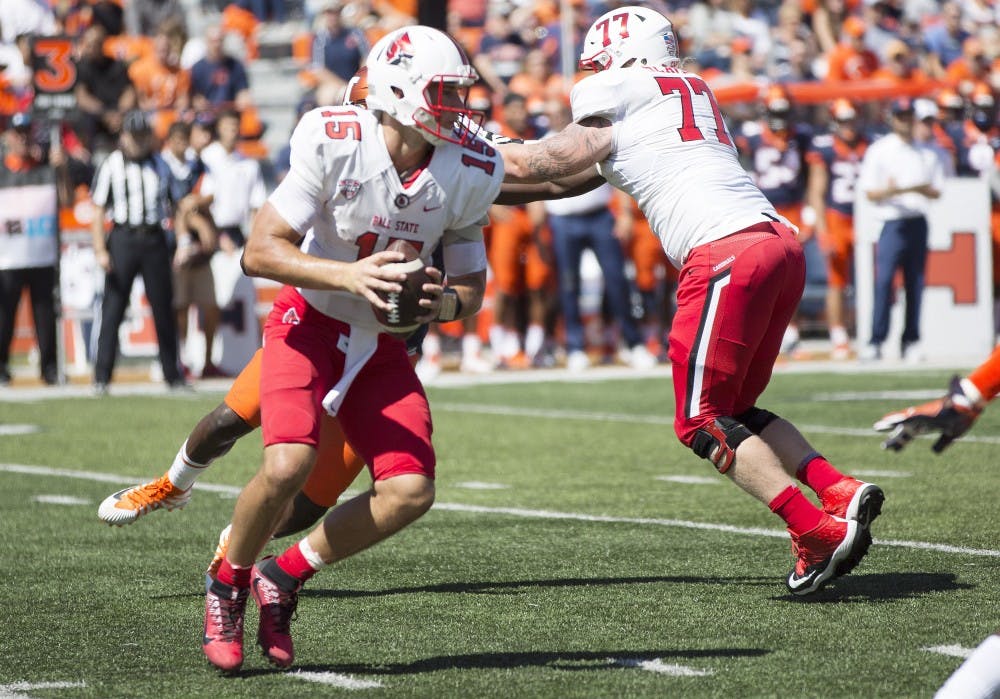 <p>Ball State quarterback Riley Neal looks upfield playing against the University of Illinois on Sept. 2, 2017. Neal finished the game with 204 passing yards, a passing touchdown and 41 rushing yards. Ball State lost 24-21. <strong>Robby General, DN</strong></p>