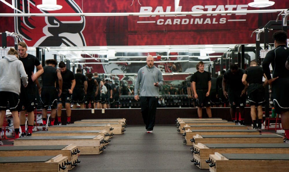 Ben Armer blows his whistle to start warm ups on Sept. 29 in the football weightroom. Armer is the director of strength and conditioning for Ball State's football team. Kaiti Sullivan, DN
