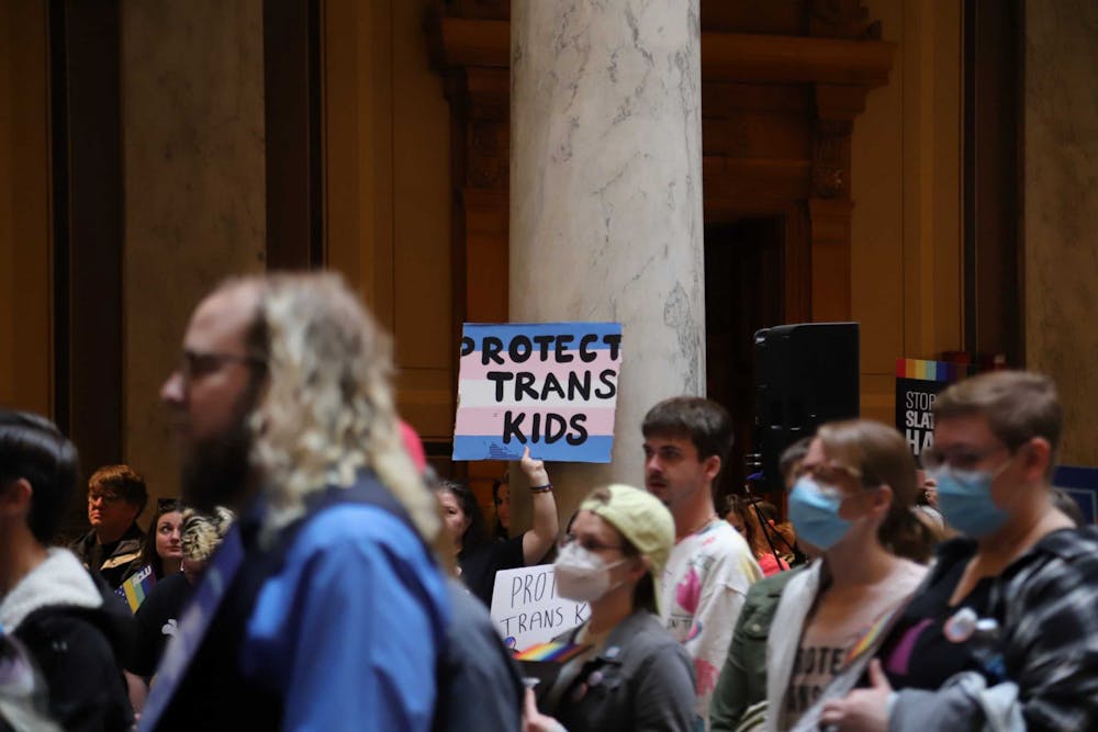 Attendee of the ACLU Rally to Protect Trans Youth holds up a sign at the Indiana State House on April 1. The rally was held in relation to SB 480. Olivia Ground, DN 