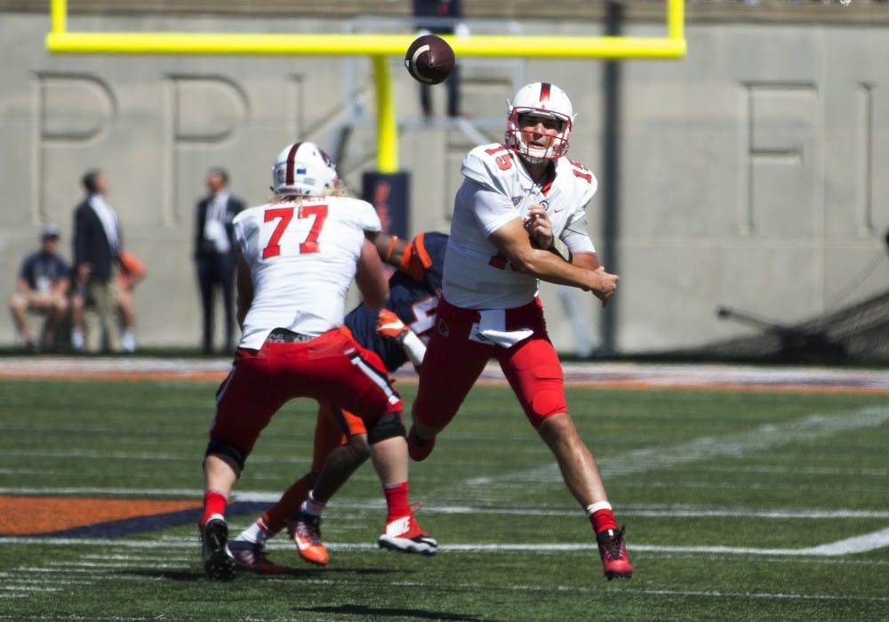 <p>Ball State quarterback Riley Neal throws a pass during the first quarter against the University of Illinois on Setp. 2, 2017. Neal finished the season opener with 204 passing yards and a touchdown. <strong>Robby General, DN</strong></p>
