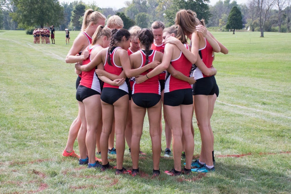 The Ball State team gathers before the meet begins at the cross country meet against IUPUI on Sept. 23, 2016 at the Muncie Elks Country Club.  Ball State won against IUPUI 16-46. Kaiti Sullivan // DN