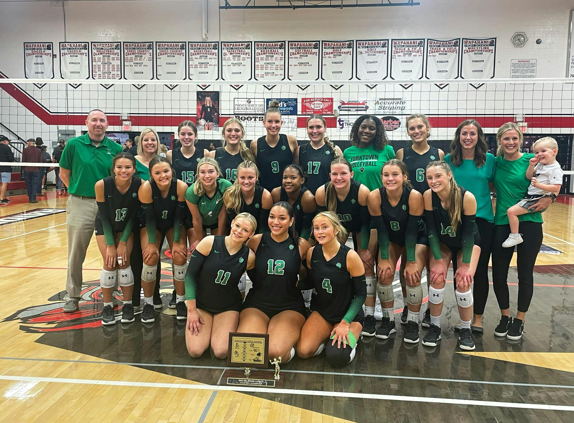 VB Yorktown volleyball poses with the trophy Sep. 30 after winning the Delaware County Championship. Zach Carter, DN. 