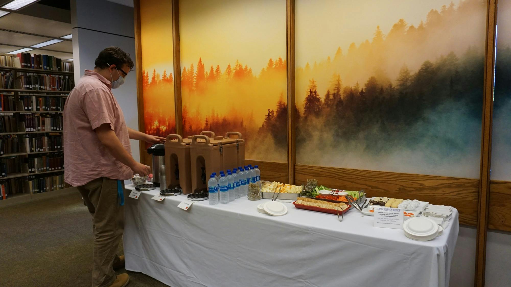 A visitor fills a cup with coffee at Bracken Library&#x27;s newly-opened contemplation space Sept. 29, 2021. The opening of the area was celebrated with snacks and speeches from university faculty. Hannah Amos, DN