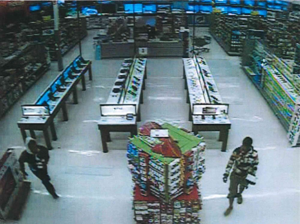 <p>Muncie Police are seeking the public's help in identifying two suspects who robbed a Muncie Walmart early Monday morning. Anyone with information is asked to call Muncie Crime Stoppers. Photo provided, Muncie Police Department</p>